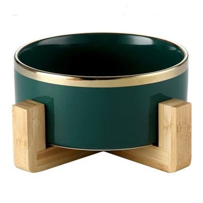 Elegant ceramic food bowl with gold rim and stable wooden base
