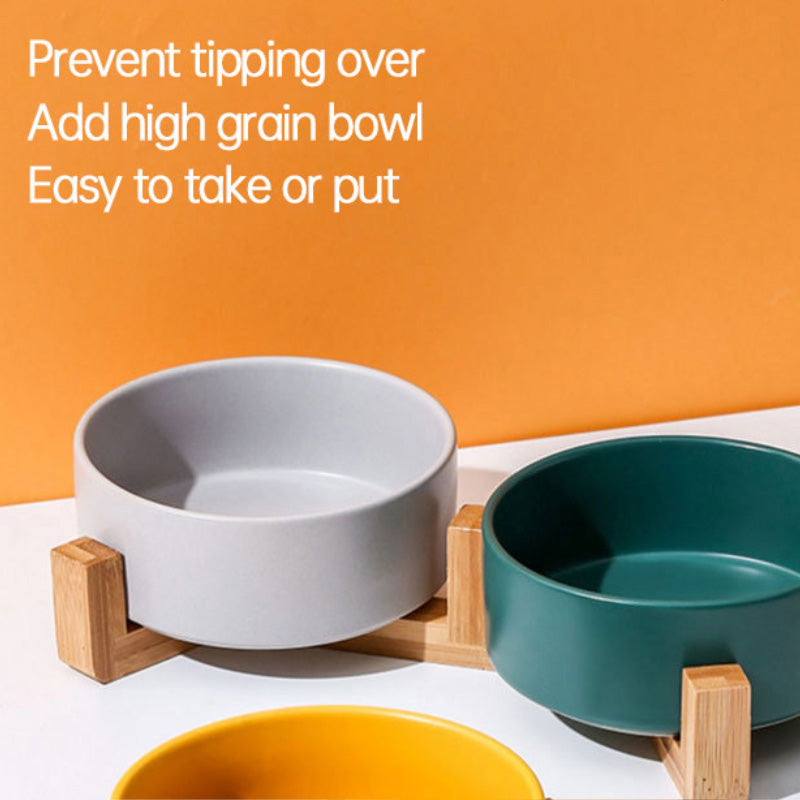 Ceramic food bowl with stable wooden base in a clean design